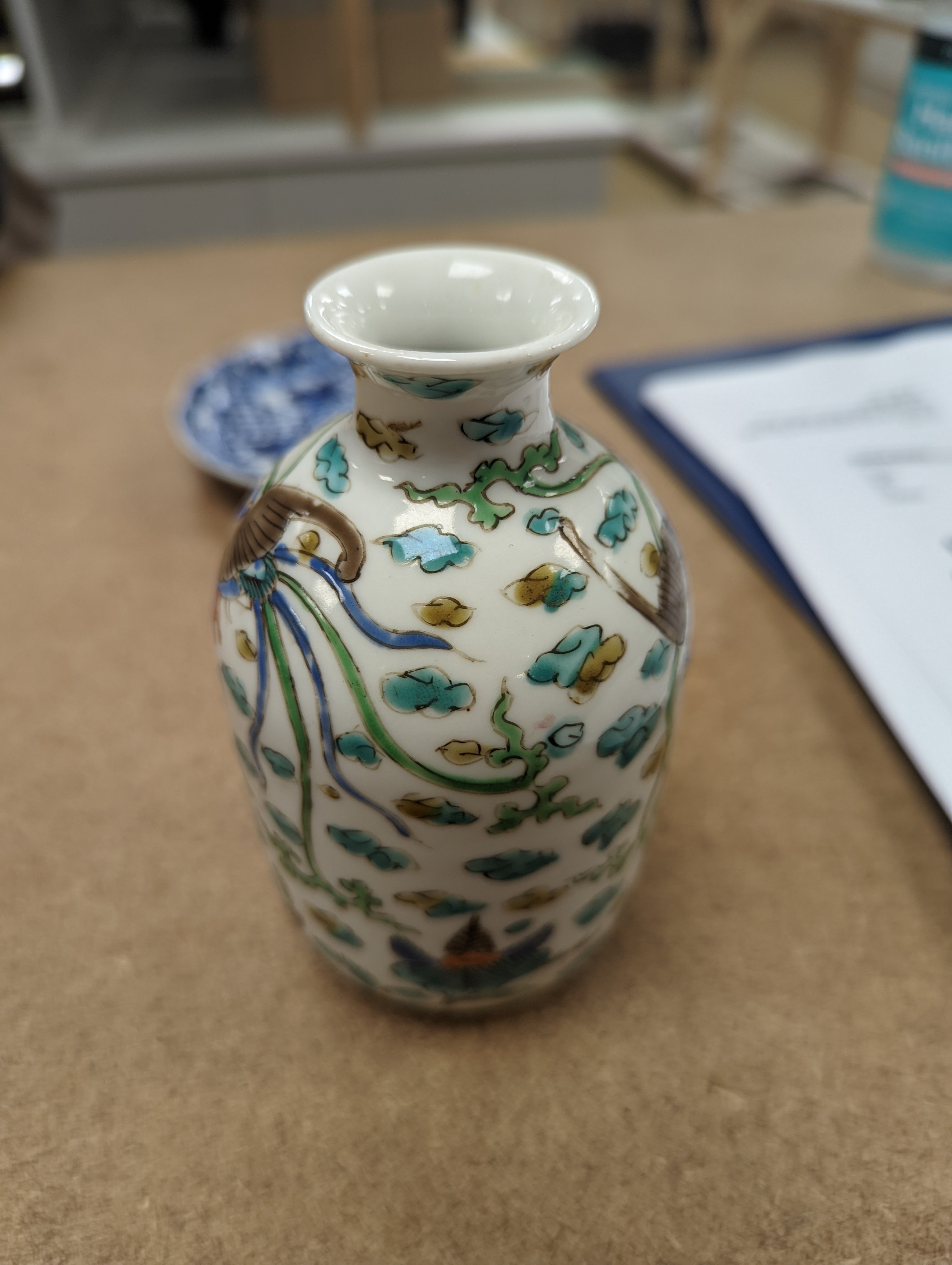 Two Chinese porcelain saucer dishes and an enamelled porcelain vase, 18th century and later, 12.5cm